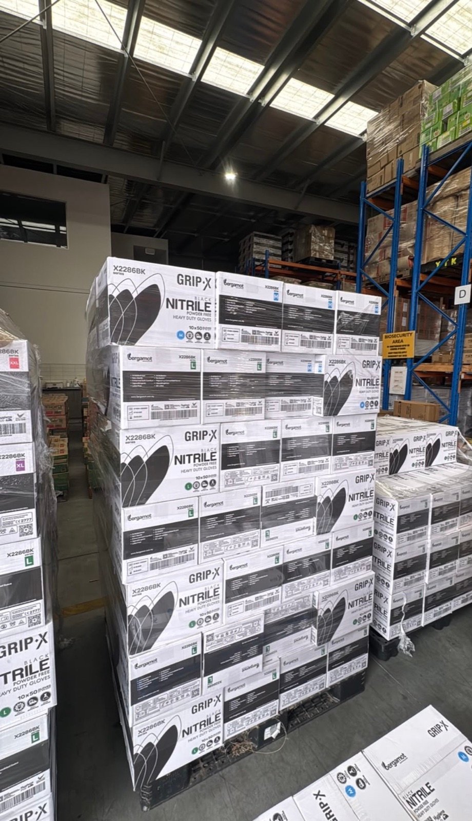 Pallets of Grip-X black nitrile glove boxes stacked in the ProFit WA warehouse
